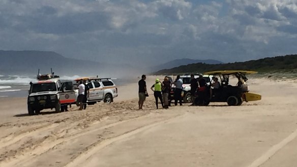 Emergency crews at Lighthouse Beach, near Port Macquarie, searching for a boy swept out by a rip this week while swimming.