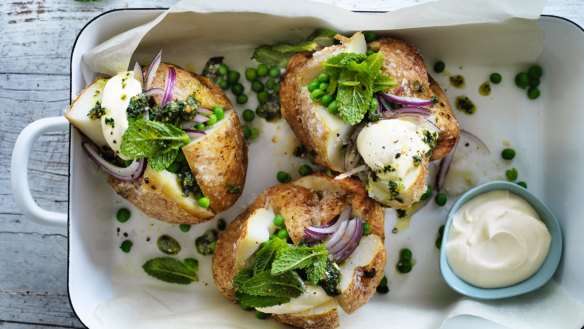 Baked potatoes with peas and pesto.