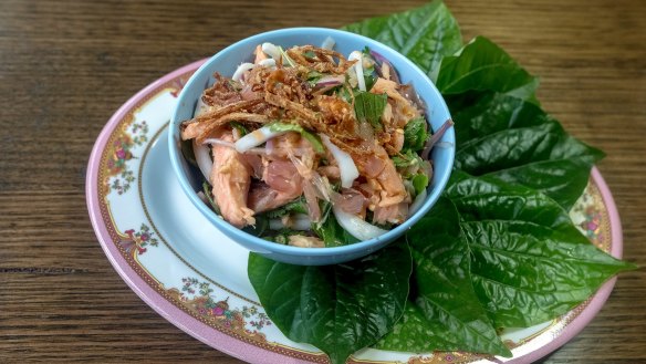 Smoked trout and pomelo with betel leaves.