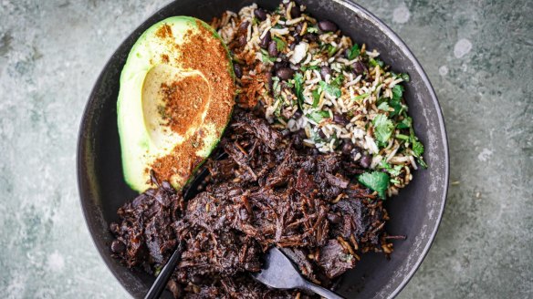 Mexican beef cheek stew with beans, rice and spiced avocado.