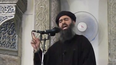 This image made from video posted on a militant website on July 5, 2014,  purports to show the leader of IS, Abu Bakr al-Baghdadi, delivering a sermon at a mosque in Iraq.