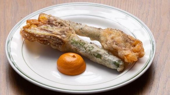 Fried zucchini flowers with romesco sauce.