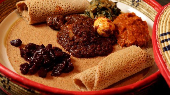 Cheap thrills: Red split lentil, chicken, diced beetroot and silverbeet served on injera bread at Saba's.