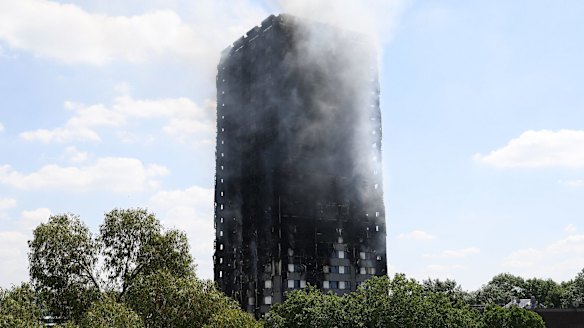 Smoke continues to rise from the burning 24-storey Grenfell Tower block in Latimer Road, west London.