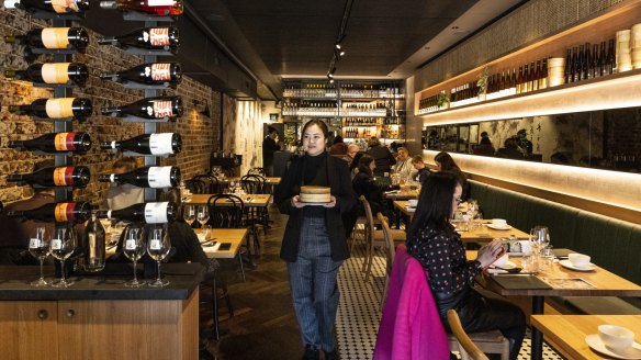 Wine bottles are integral to the decor at Lotus Dumpling Bar in Summer Hill.