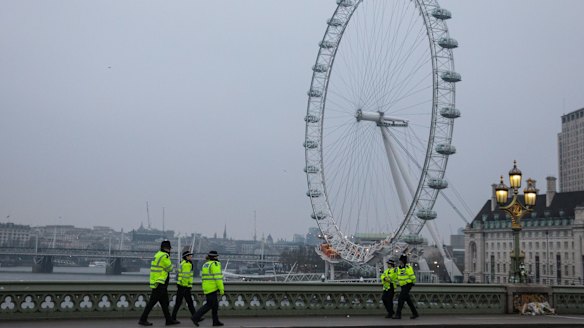 The strong police presence on Westminster Bridge after it opened to the public again on Friday.