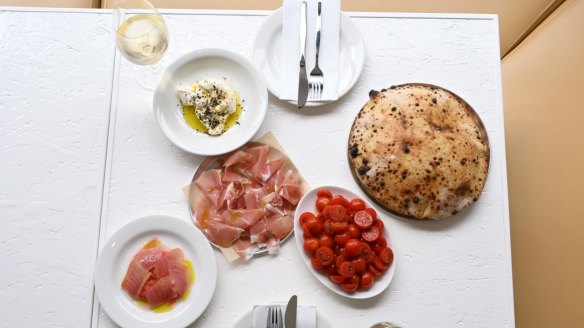 Antipasti and wood-fired bread are a ritual for diners at Totti's.