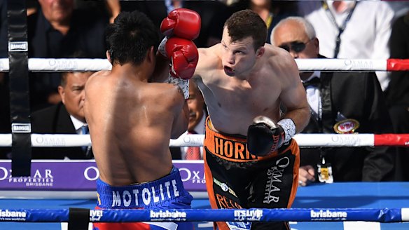 Man v mountain: Manny Pacquiao and Jeff Horn trade blows. 