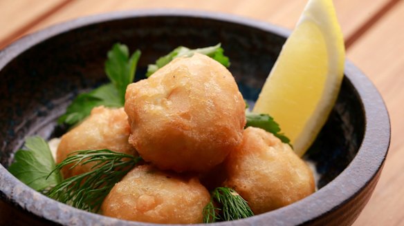 Codfish Shanty Fritters, tasty swiped through charred lemon mayonnaise. 