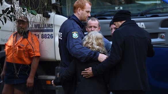 NSW Detectives embrace Matthew Leveson's parents Mark and Faye after locating the possible burial place of their son.
