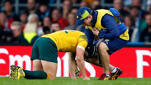 In a world of pain: Matt Giteau after a tackle went wrong.