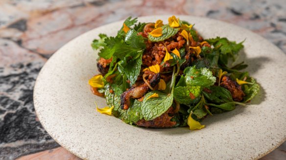 Go-to dish: Crispy rice salad with red curry pork sausage and mussels.