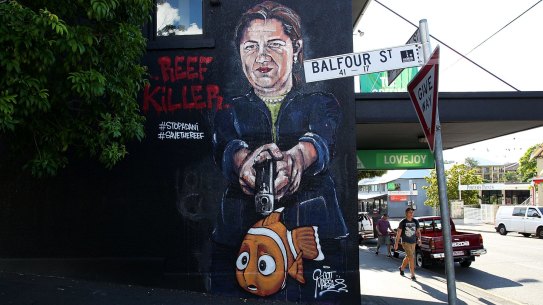 Queensland Premier Annastacia Palaszczuk depicted holding a gun to Nemo's head in an anti-Adani street mural in New Farm.