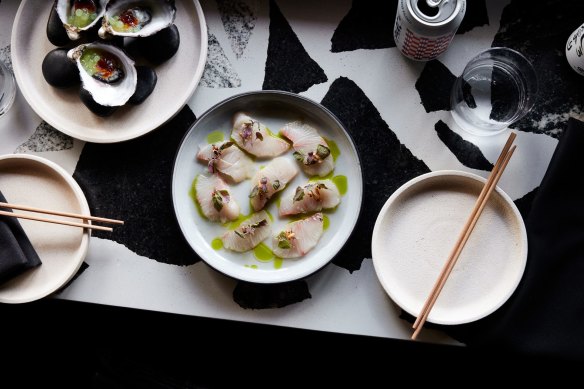 Kingfish with ginger and yuzu vinaigrette, shiso and kombu oil.