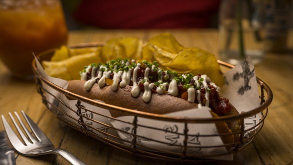 The L'Hot dog: pork and fennel sausage, provolone and red pepper relish in a brioche bun.