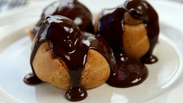 Profiteroles with chocolate sauce.