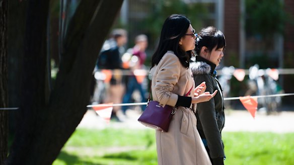 Students walking on the ANU campus on Wednesday. 