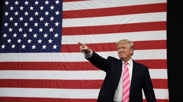 Republican presidential candidate Donald Trump takes the stage at a rally on Saturday in Manheim, Pennsylvania.
