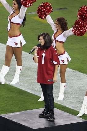 Musician Christina Grimmie performs the National Anthem before the NFL game at the University of Phoenix Stadium in 2014 in Glendale, Arizona.