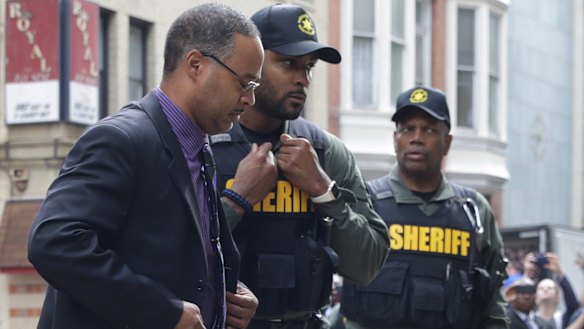 Officer Caesar Goodson, left, one of six Baltimore city police officers charged in connection to the death of Freddie Gray.