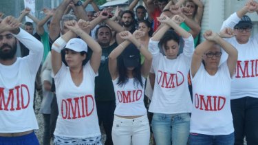 Refugees at Nauru wear t-shirts with Omid Masoumali's name as a show of solidarity.