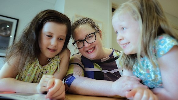 Jessica Doyle with daughters Ruby, 8, and Lily, 5, at their home in Preston. As a parent, "trying and failing is part of life," Ms Doyle says.