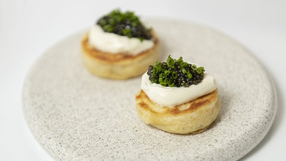 Caviar and creme fraiche on crumpets.