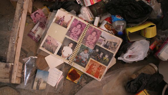 A family photo album in the rubble of a home in Sinjar.