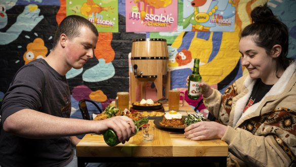 Sam McGill and Bri Fisher from Granville enjoy soju at Korean eatery Gami in Campbelltown.