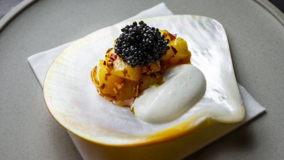 Automata's scallop with oyster emulsion, marigold and sturgeon caviar.
