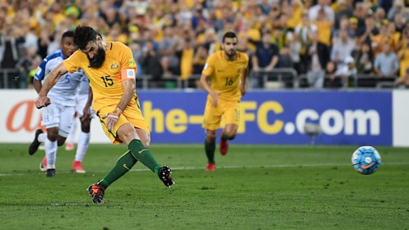 Mile Jedinak scores from the penalty spot the first time around.