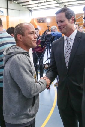 Farewell: Former Manly coach Geoff Toovey shakes the hand of Scott Penn after the press conference announcing the coach's sacking in July last year.