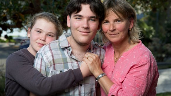 Karen Crawley with her children, Samantha, 11, and Braden, 17, in Sydney. Her oldest daughter, Kara, passed away from mitochondrial disease and her son has just been told that he is suffering from the same genetic illness.