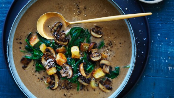 Lighten up: Brown mushroom and spinach soup with crunchy croutons.
