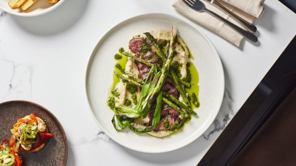 Picanha steak with truffle potato puree, asparagus, spring onion and chimichurri.