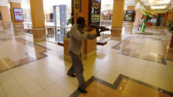 September 2013: an armed policeman searches for gunmen during the attack at  the Westgate shopping mall.