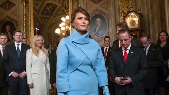 First lady Melania Trump wore a light blue suit, reminiscent of Jackie Kennedy's famous look.