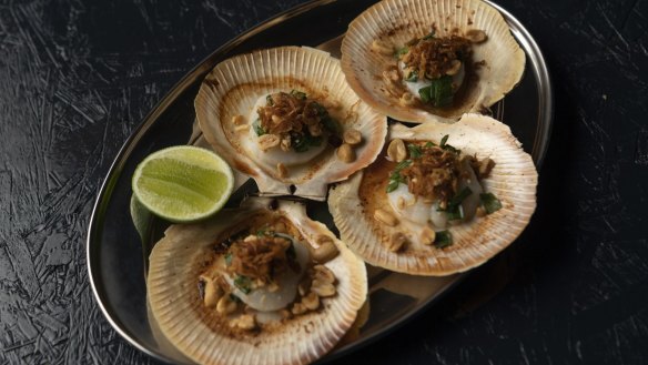 Grilled scallops with spring onion relish and peanuts.