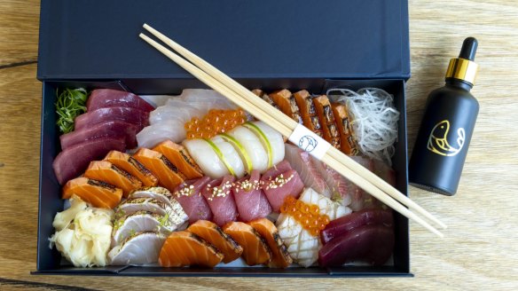 Uminono's small sashimi box complete with gold-embossed soy sauce.