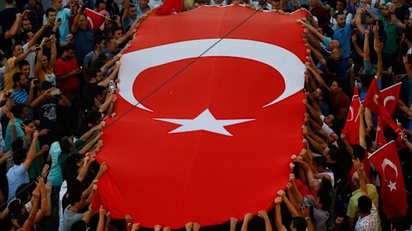 People gather at a pro-government rally in central Istanbul's Taksim square on Saturday.