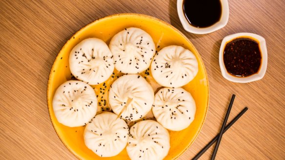 Pan-fried dumplings with black rice vinegar are big, thick-skinned and pork-filled.