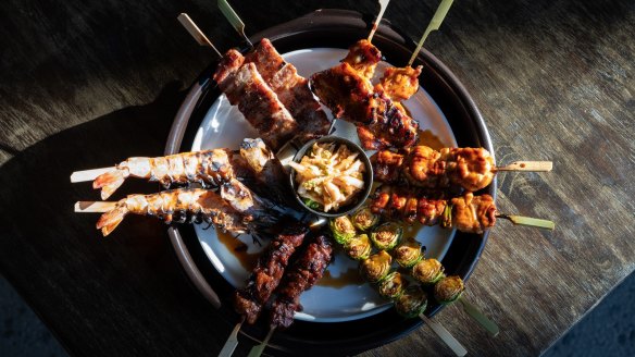 Yakitori options include chicken tori-neg (with shallot), pork jowl, brussels sprouts and semi-dried calamari.