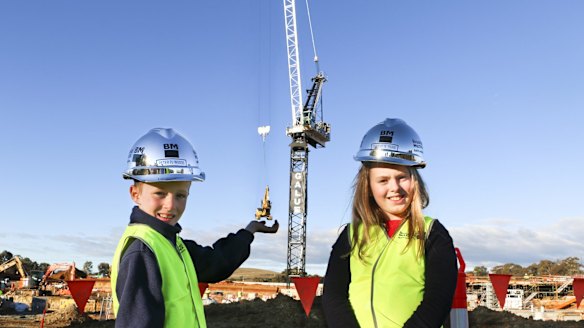 Peter ''PJ'' Woods, 7, and Charlotte Young, 10, won a competition to name the crane building the University of Canberra Public Hospital.