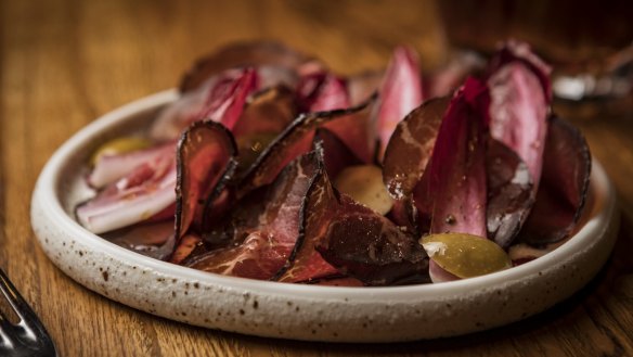 Wagyu bresaola with radicchio, green olives and pinot vinaigrette.