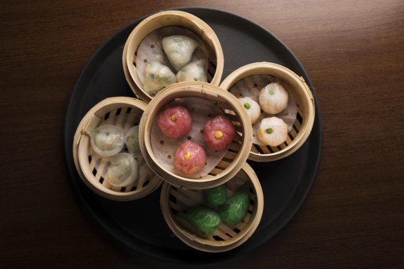 Steamed vegan dumplings of many colours.