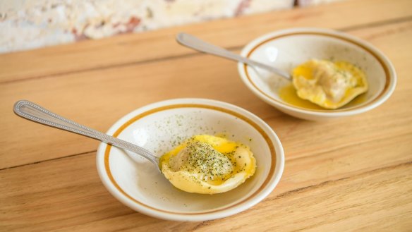 "Pasta on a spoon" might be a singular duck raviolo with mandarin butter.