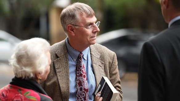 Scott Johnson's partner Michael Noone leaving the court after giving evidence to the inquest.