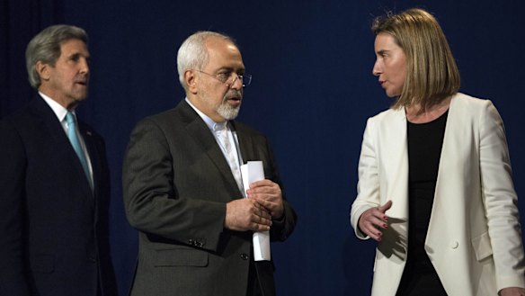 US Secretary of State John Kerry, Iranian Foreign Minister Javad Zarif and EU High Representative for Foreign Affairs Federica Mogherini arrive to deliver a statement in Lausanne.