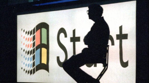 Bill Gates sits on stage during a portion of the Windows '95 launch  event in 1995.