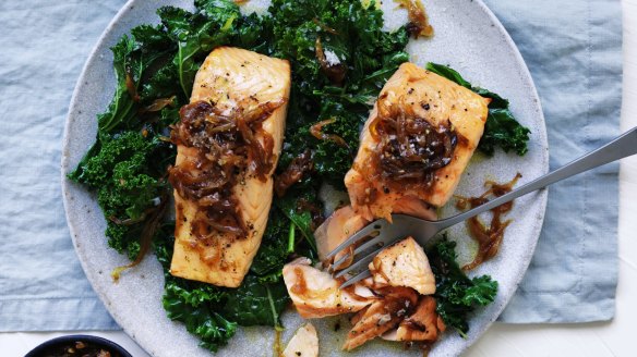 Frozen fillets and kale are fine substitutions for this simple dish of salmon with caramelised onion and wilted greens.